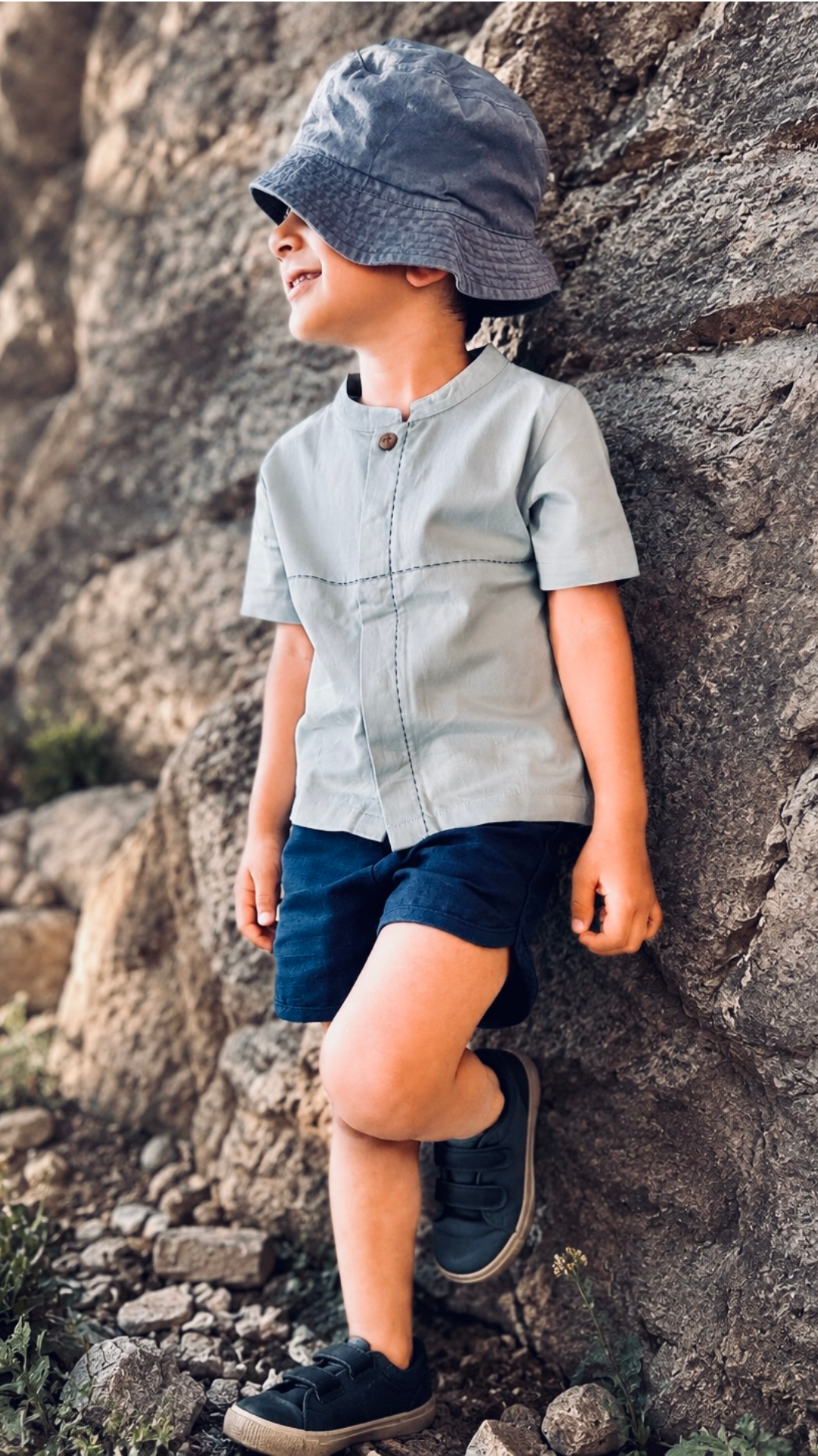 Stone Loom Shirt — engraved wooden button and stitch detail close-up