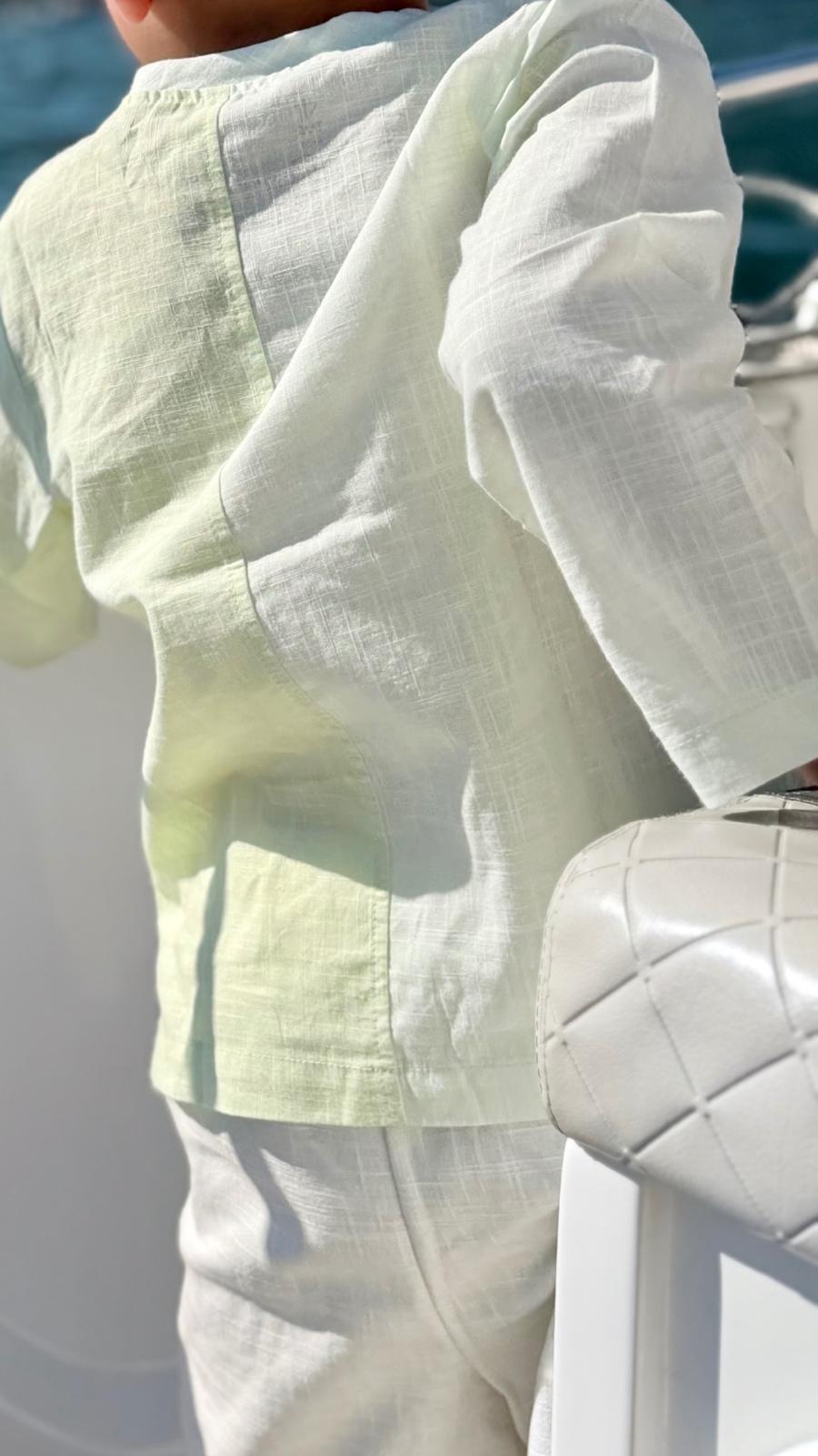 Mint Whisper Shirt — asymmetric button and embroidery detail close-up