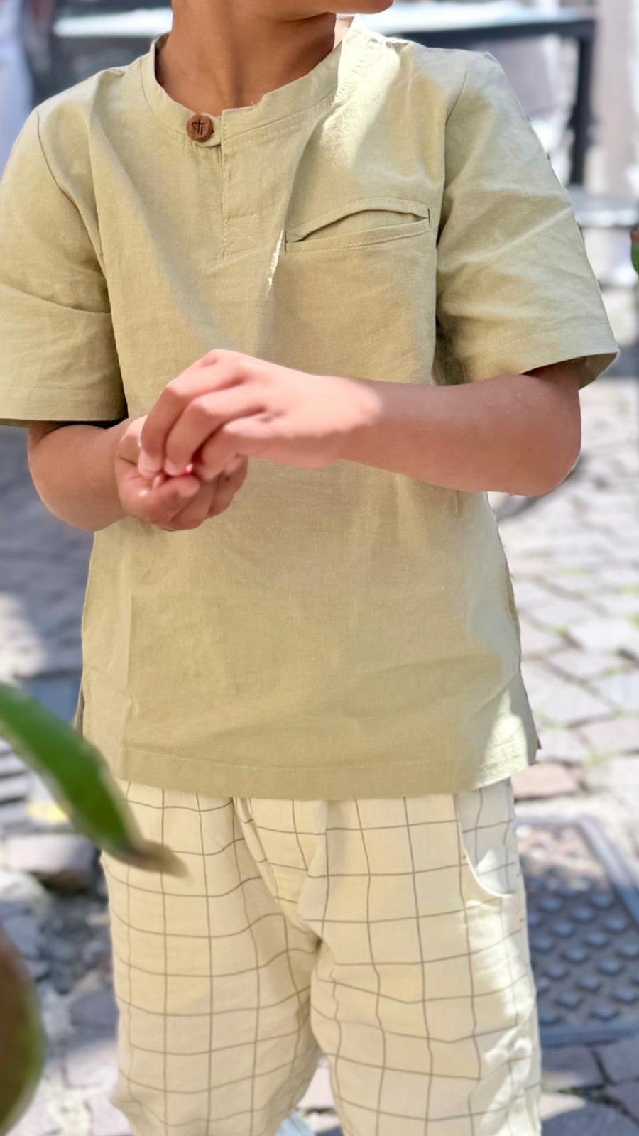Sagewood Reverie Top — wooden button and welt pocket detail close-up