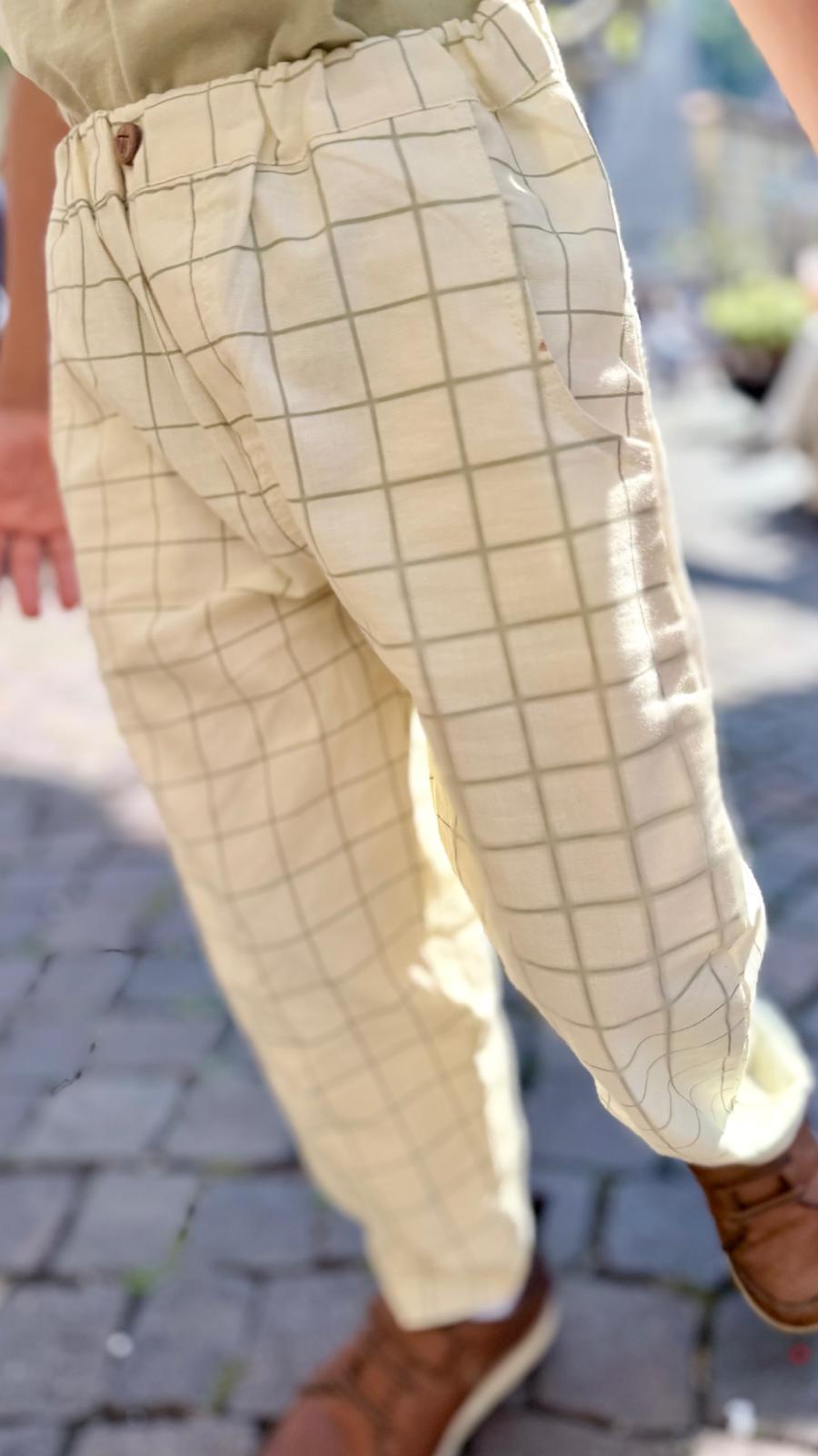 Olive Grid Cream Pants — wooden button and waist detail close-up